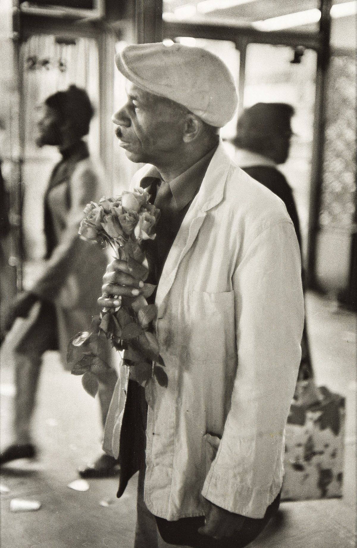 BEUFORD SMITH (1941 - ) Man with Roses, 125th St.